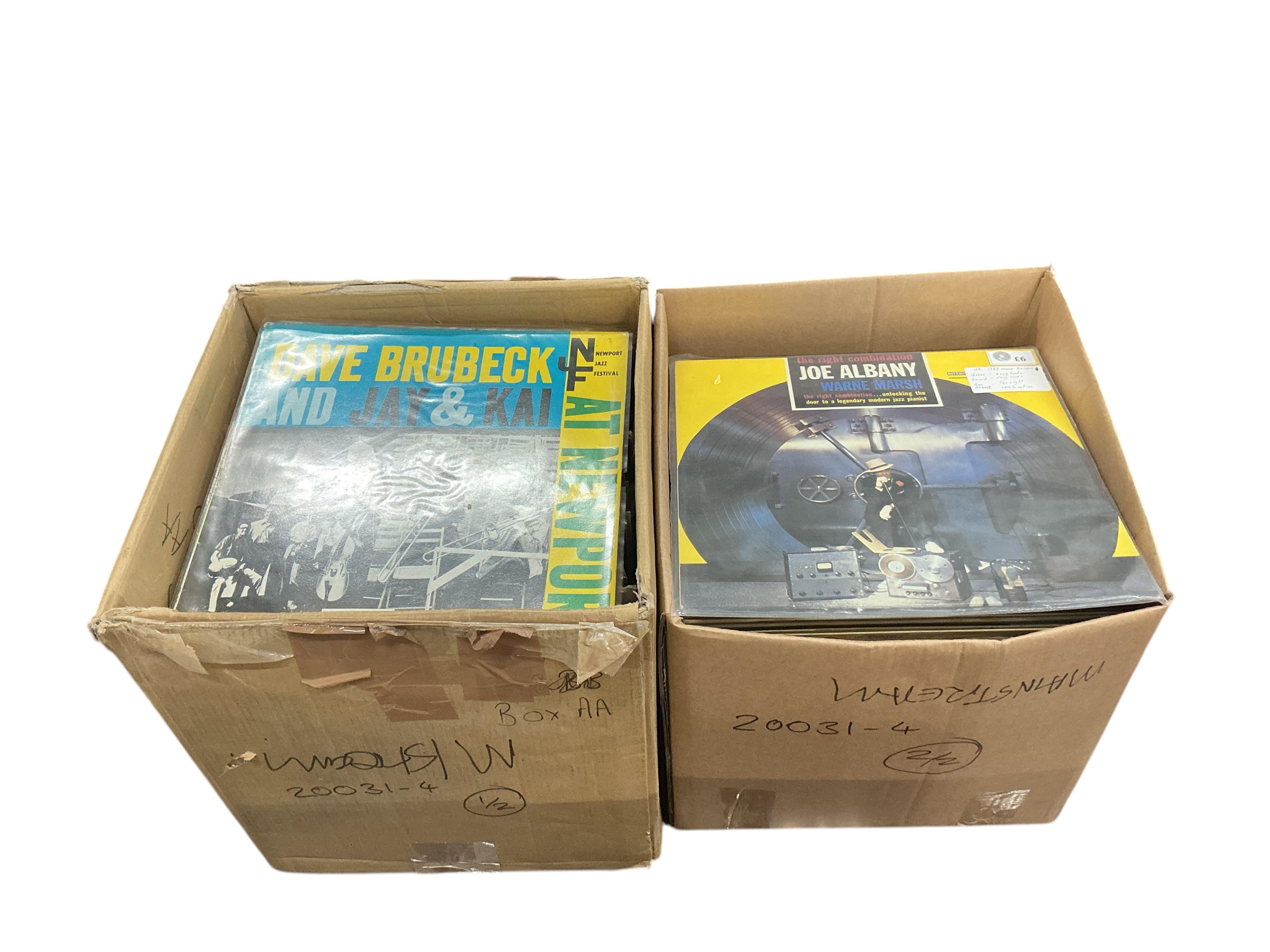 Two boxes of jazz LP record albums, artist including; Louis Armstrong, Lester Young, Stan Getz, Anita O’Day, Jimmy Smith, Dave Brubeck, Duke Ellington, Earl Coleman, Annie Ross, Ray Charles, Erroll Gardner, etc.
